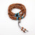 Artisan d'Asie Colliers Malas Collier mala en bois de santal, pierre d'obsidienne et turquoise